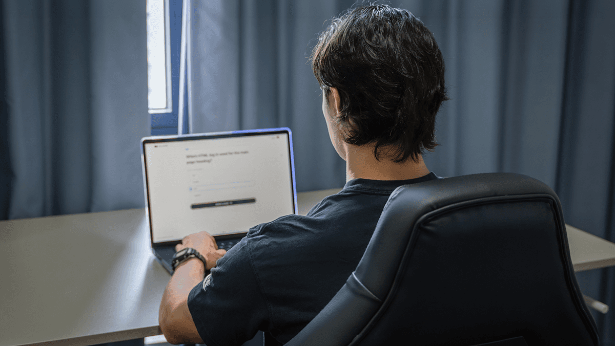 A person taking the online Network School Exam